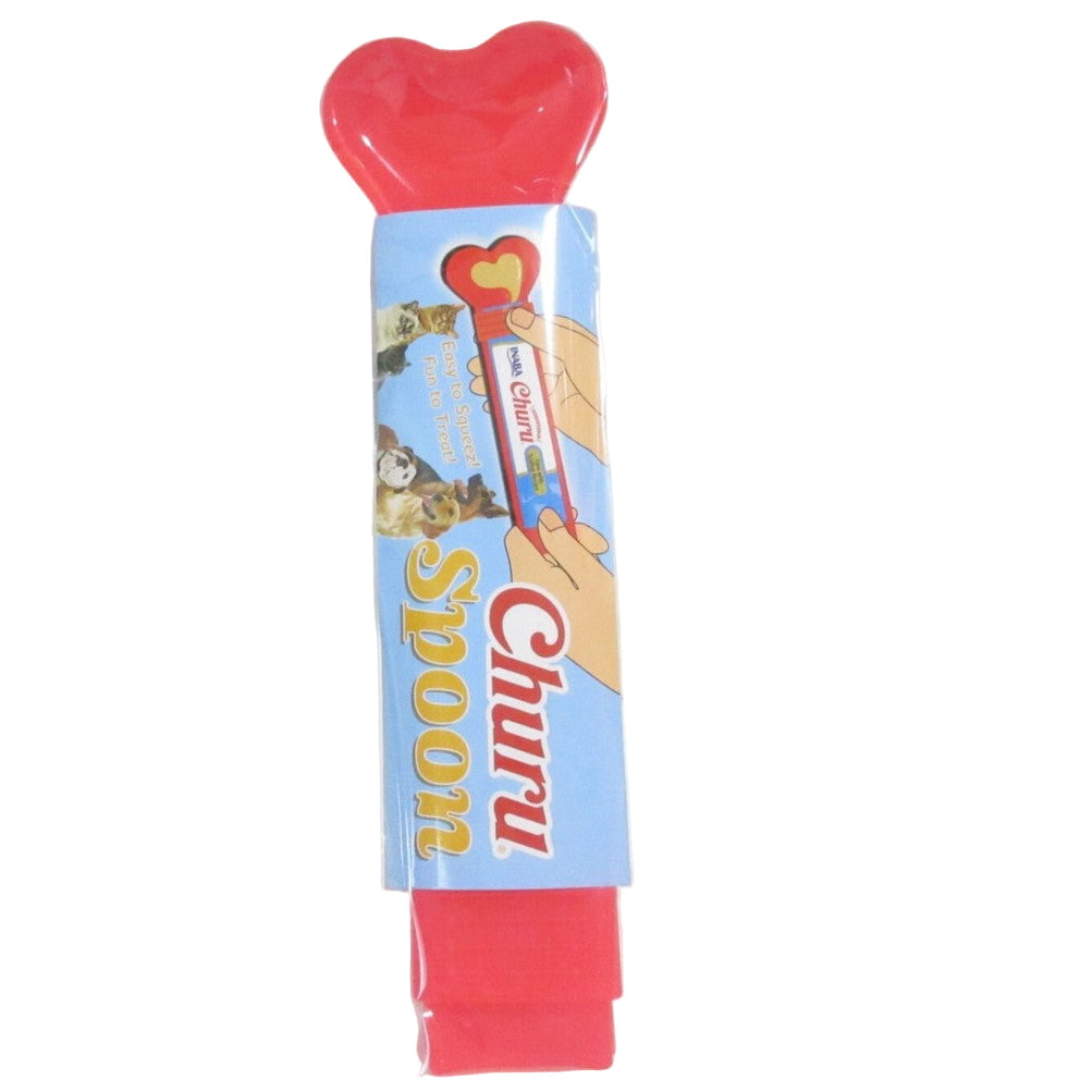 Red spoon with heart-shaped handle in clear packaging on a white background